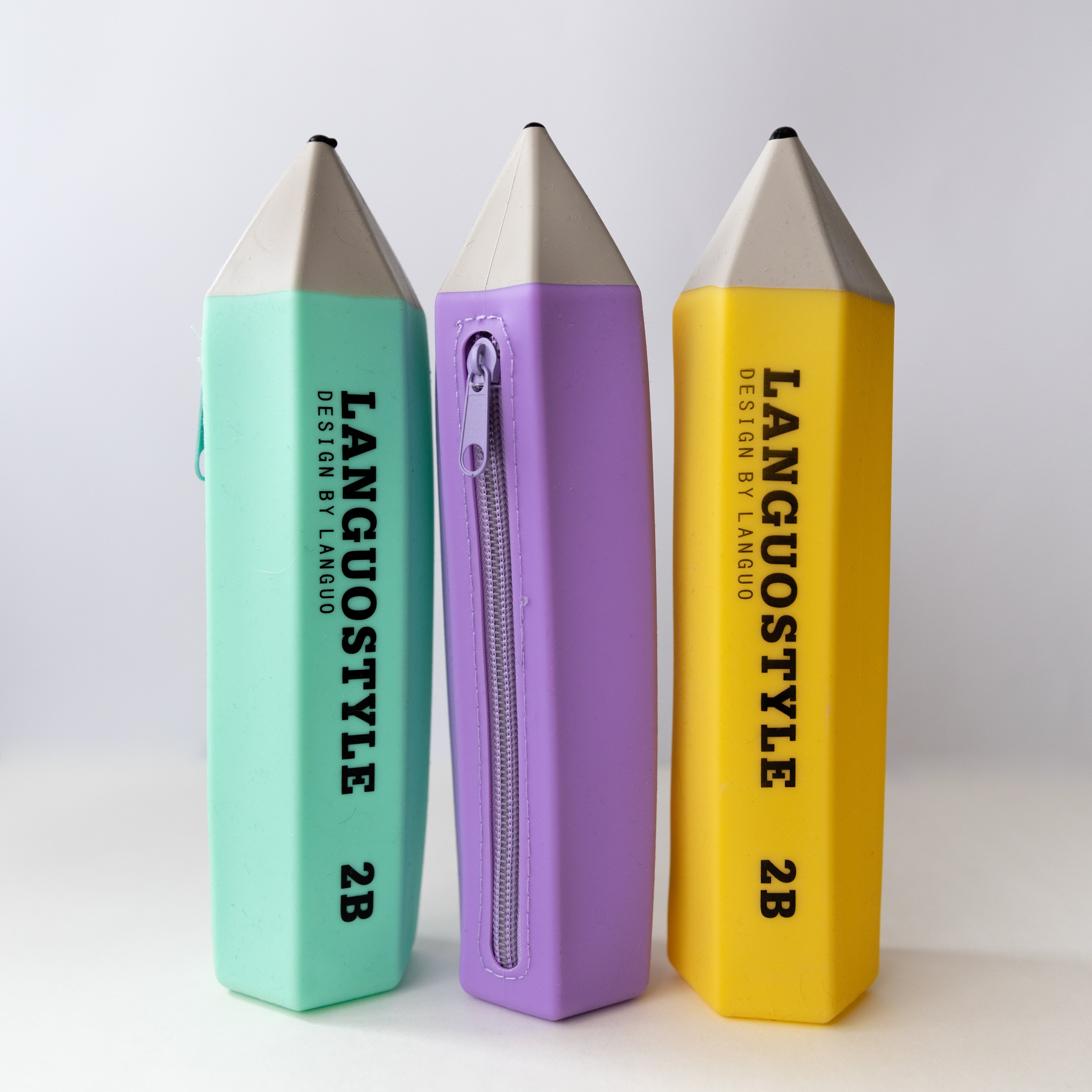 turqoise, purple and yellow silicone pencil shaped pencil case