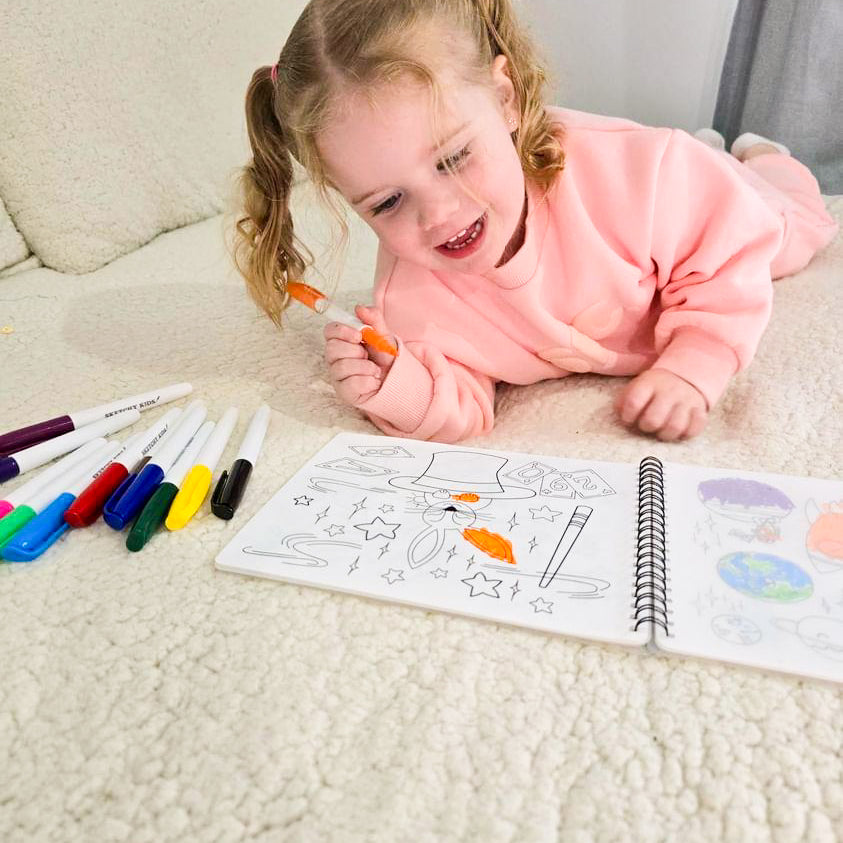 Child using reusable colouring book by Sketchy Kids