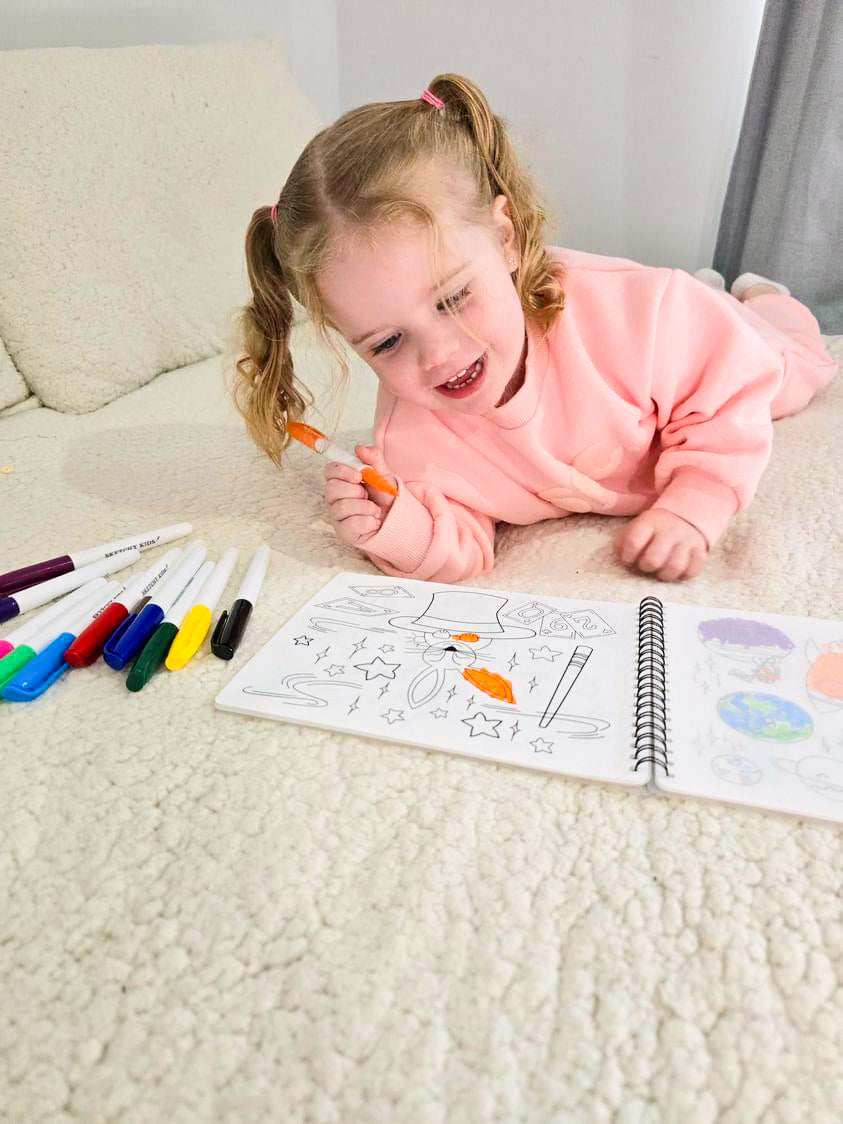 Child using reusable colouring book by Sketchy Kids