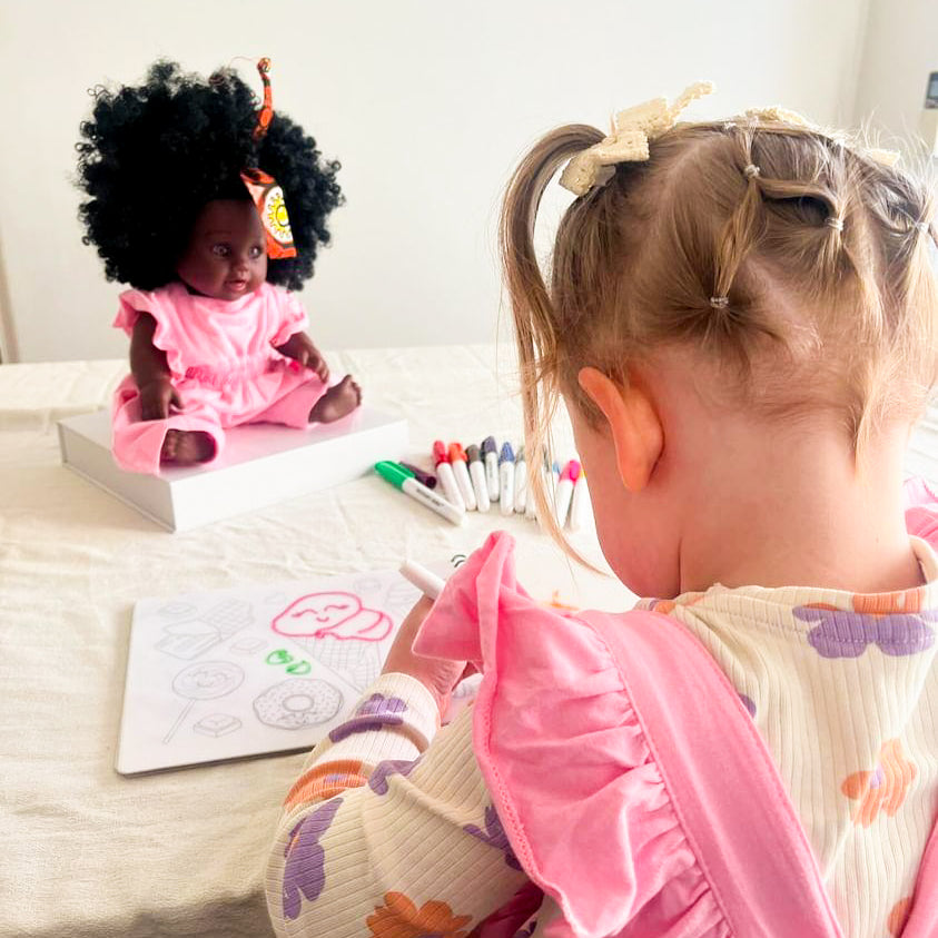 Child using reusable colouring book by Sketchy Kids