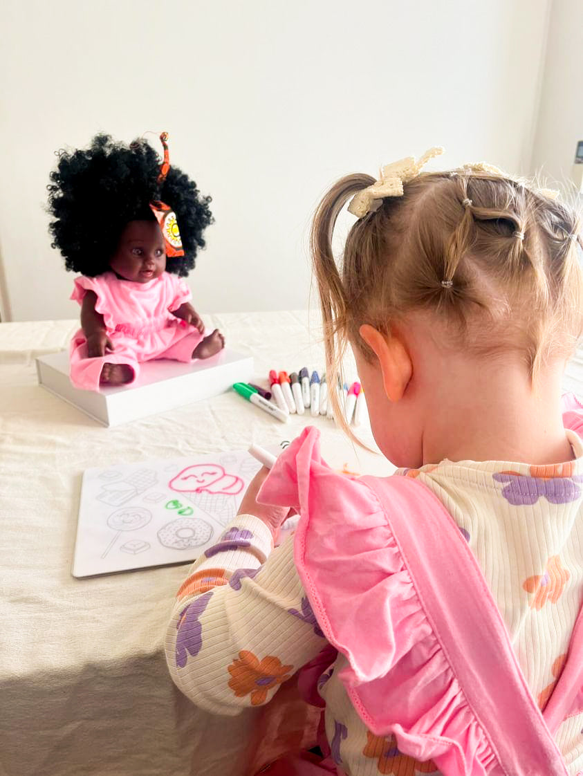 Child using reusable colouring book by Sketchy Kids